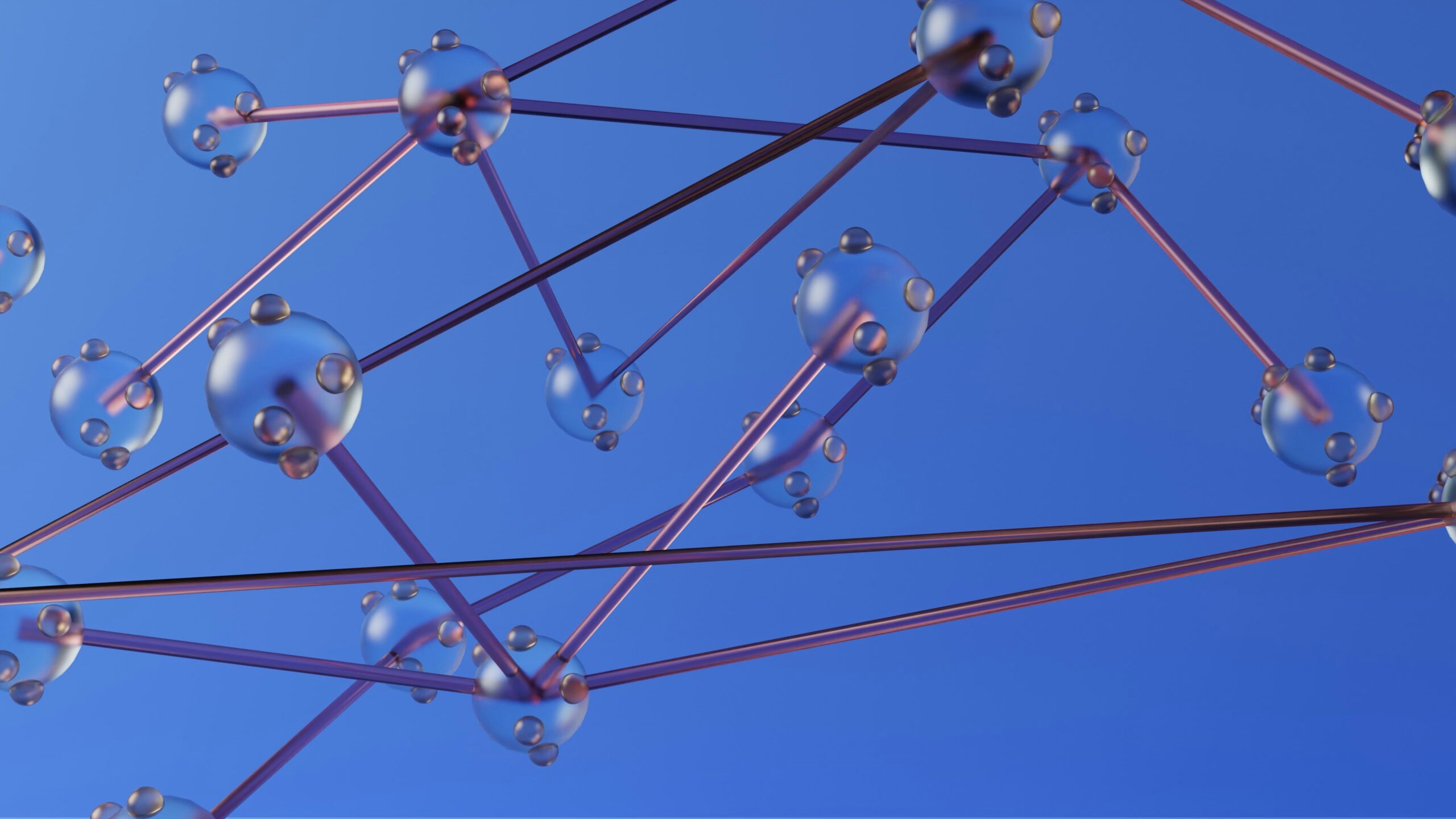 Translucent spheres connected by thin rods, arranged in a geometric network against a blue background. The structure resembles linked data nodes, suggesting relationships and organized information